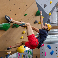 woman climbing on top rope